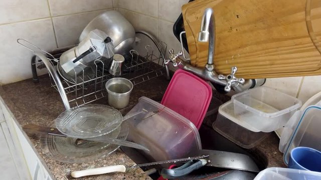 Dirty sink. Bacteria proliferate easily in dirty dishes.
