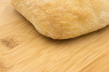 Chiabata bread bun closeup  on wooden background