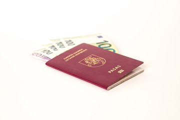 Lithuanian passport with euro money inside for travel or taxes
