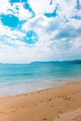 Sea beach scenery with beautiful water and clouds. vertical orientation