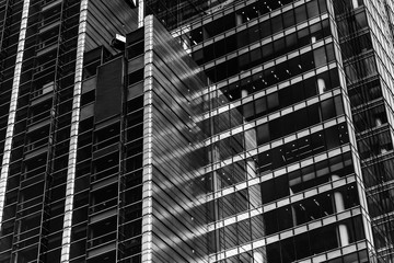 Fototapeta na wymiar Office buildings. modern glass and concrete silhouettes of skyscrapers. Black and white background.