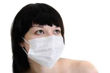 close-up portrait of young woman in protective medical mask on white background, isolated