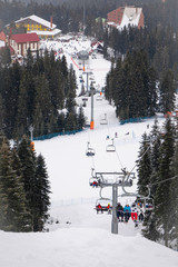 Ilgaz ski center in national park in winter time with lift and skiers