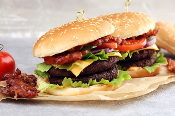 Tasty fresh meat burgers with salad and cheese. Homemade angus burger.