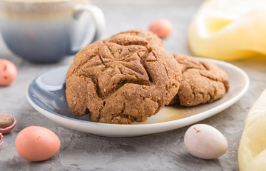 homemade oatmeal cookies with a cup of cocoa on a gray concrete background. side view, selective focus.