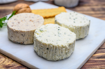 Spread cream cheese with herbs, garlic, chives and spices close up