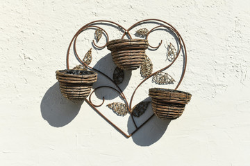 Wicker flowerpots hanging on the wall