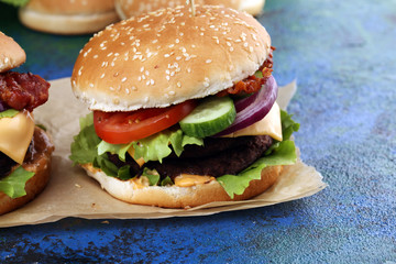 Tasty fresh meat burgers with salad and cheese. Homemade angus burger.