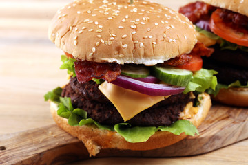 Tasty fresh meat burgers with salad and cheese. Homemade angus burger.