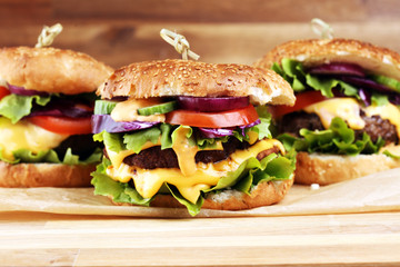 Tasty fresh meat burgers with salad and cheese. Homemade angus burger.