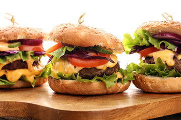 Tasty fresh meat burgers with salad and cheese. Homemade angus burger.