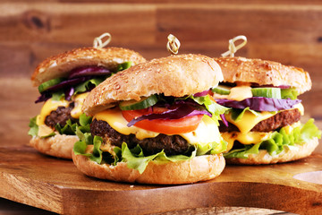 Tasty fresh meat burgers with salad and cheese. Homemade angus burger.