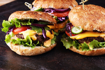 Tasty fresh meat burgers with salad and cheese. Homemade angus burger.