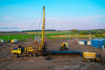 Workover rig working on a previously drilled well trying to restore production through repair. The...