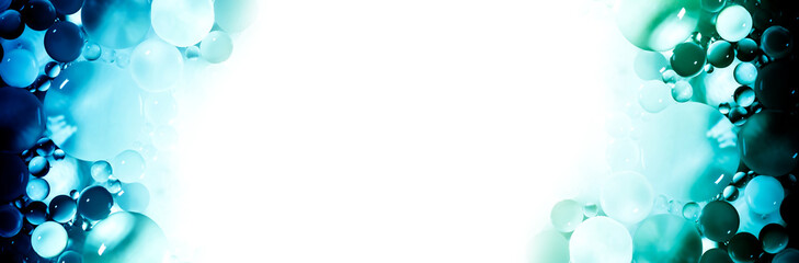 Creative abstraction frame of a colorful circles of different sizes with backlight and gradient with white isolated free space in center.