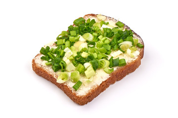 Rye bread with green onion, isolated on white background