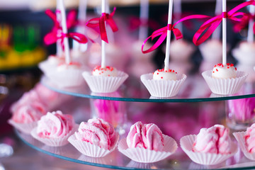 candy bar at the wedding. closeup of cake pops with a stick and