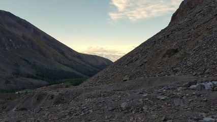 Slopes of the passes on a summer evening in the Aktru gorge.