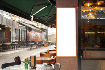 Blank billboard in the street (in front of cafe-restaurant)