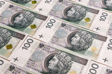 Polish banknotes. One hundred Zloty pile background. Cash money in Poland