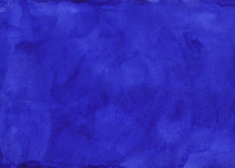 Watercolor deep indigo blue background texture hand painted.  Aquarelle stains on paper.
