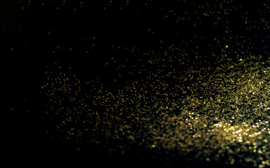 Fototapeta na wymiar Black background with golden sparkles. Blurred effect. Concept for festive background or for project.Copy space