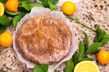 Orange cake with sliced oranges and leaves garnishing