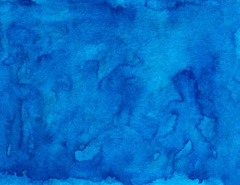 Watercolor deep blue liquid background painting texture. Hand painted watercolour backdrop. Sky blue stains on paper.