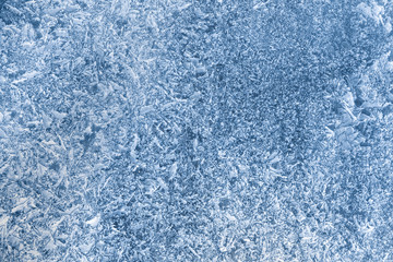 Fototapeta na wymiar The texture of thick ice on the lake, drone view.