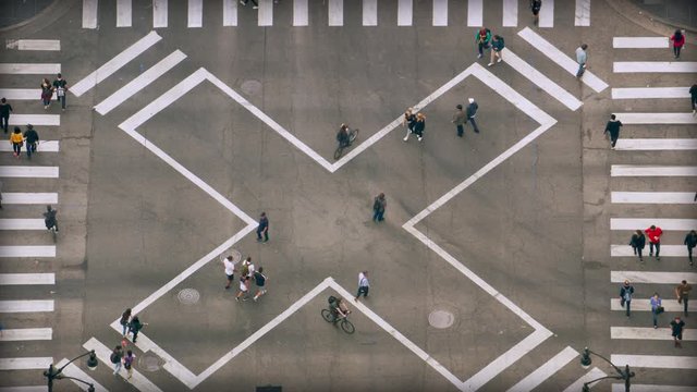 Aerial view of a crosswalk full of people. Pedestrians crossing a major avenue. United States. Shot on Red Weapon 8K 