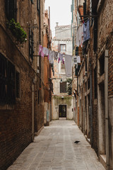 Lonely street of the city of Venice, Italy. Clothes hanging
