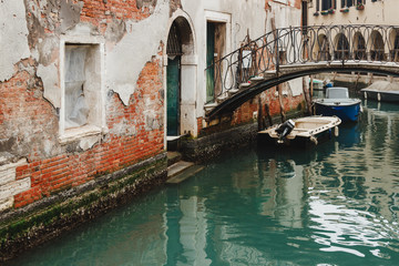 Fototapeta na wymiar Venice city channel with a bridge. Intimate. Venice Italy.