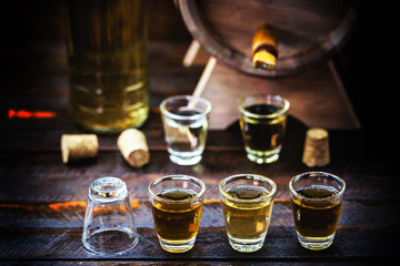 alcoholic beverages, cachaça, pinga, rum and brandy. Selection of strong and hard alcoholic drinks, glasses. Vodka, brandy, tequila, brandy and whiskey, grappa, liqueur, vermouth, rum. Copy space