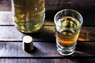Aguardiente or brandy Traditional Spanish and Brazilian drink, strong drink, grape brandy, rum, gin, silver tequila, pinga, Brazilian cachaça, Russian vodka, in glasses in an old rustic. Copy space