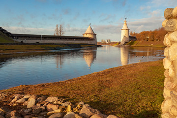View of the wall and towers of the Pskov Kremlin at the confluence of two rivers