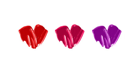 Three colors of glossy heart from lipgloss.Beautiful cosmetics smear.Isolated on white.Love make up concept.Valentines day symbol.Love cosmetics concept.