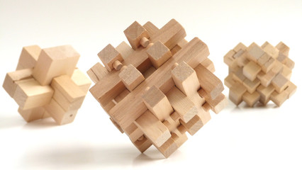 Burr Puzzles | Interlocking Puzzles | Close up of Three-Dimensional Wooden Puzzles on a White Background