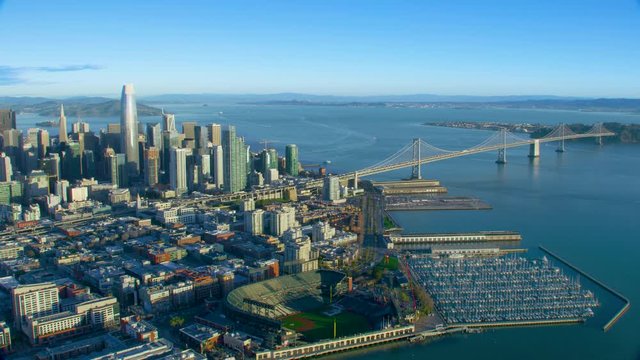 Great aerial view of San Francisco skyscrapers. City skyline, piers and bridges. Oakland Bay Bridge. California, United States. Shot on Red weapon 8K.