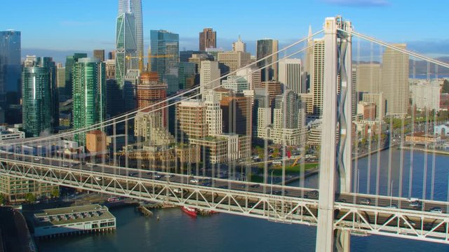 Aerial view of San Francisco financial district and the Bay Bridge. California, United States. Shot on Red weapon 8K.