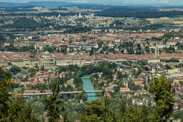 Bern, Switzerland - July 30, 2019: Panoramic view at sunny summer day fro the top of Gurten Mountain Park. Telephoto lens shot