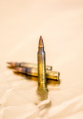 ammunition with gold background - three rounds