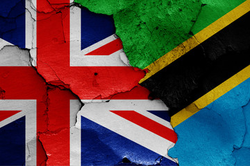 flags of UK and Tanzania painted on cracked wall