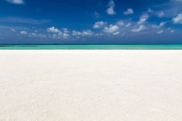 Beautiful beach with white sand. Tropical sea with cloudy blue sky . Amazing beach landscape