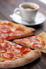 tasty pizza on the wooden background