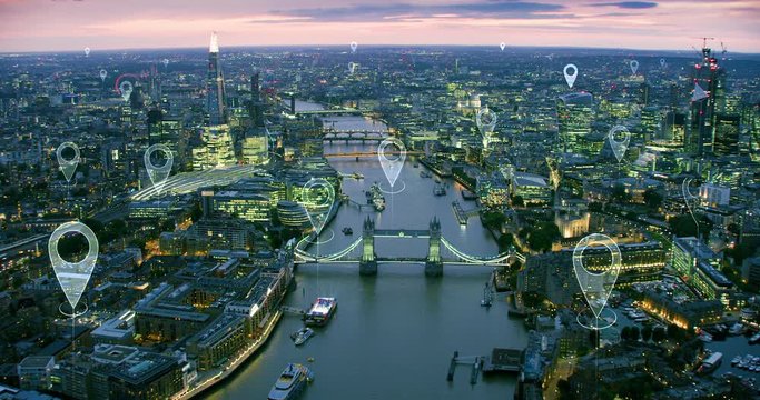 Localization icons over London. Aerial view of a smart and futuristic city. Skyscrapers in the financial district. Perfect to illustrate technological concepts as: data communication, IOT.
