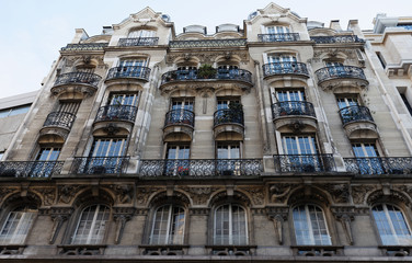 Fototapeta premium Traditional French house with typical balconies and windows. Paris.