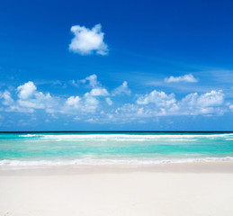 Beautiful beach with white sand. Tropical sea with cloudy blue sky . Amazing beach landscape