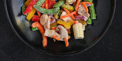 frozen vegetables mix salad (onions, corn, peppers, paprika, mushrooms, asparagus beans, carrots and others, ketogenic diet) menu concept. food background. top view. copy space