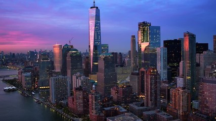 Lower Manhattan skyline, Famous skyscrapers during sunset in the Financial District of New York City. United States, North America. Shot from helicopter. - Powered by Adobe