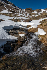 Snowy stream in the mountains